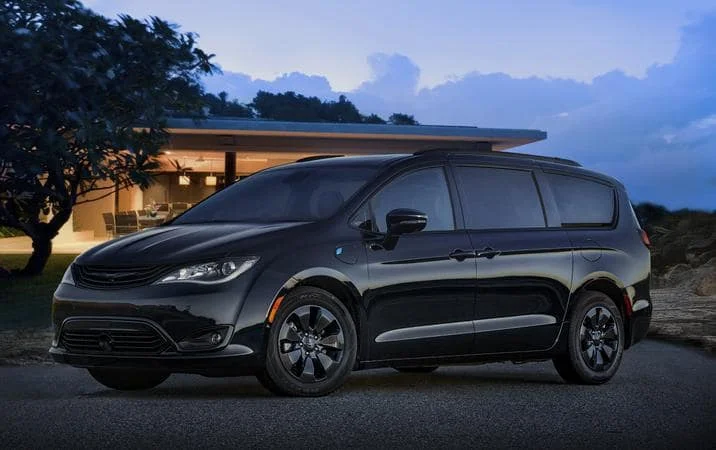 Chrysler Pacifica outside a contemporary home
