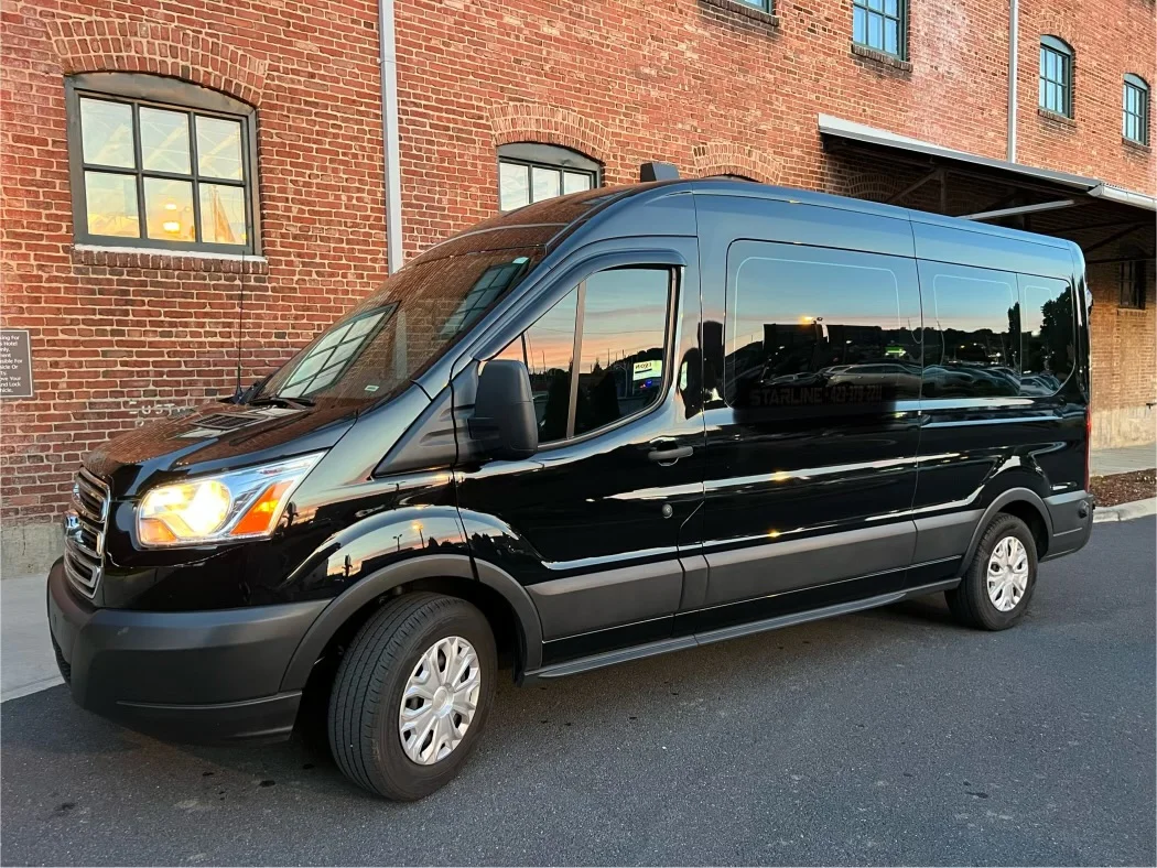 Black Ford Transit passenger van